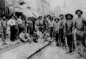 Workmen laying track for the Indianapolis-Louisville Interurban in Downtown Seymour. The Tracks were operated for nearly 40 years.